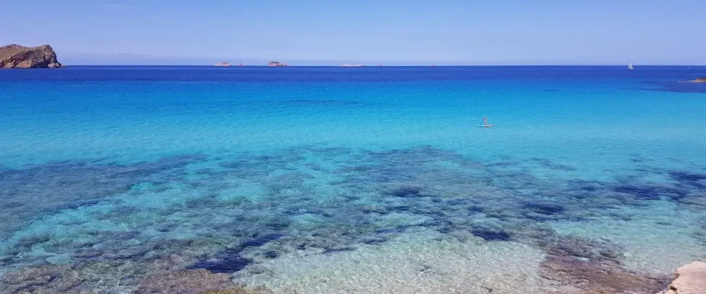 View of a beach with blue waters in Spain.