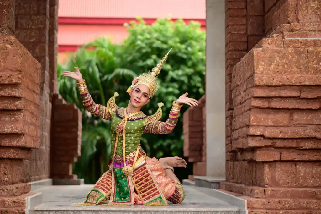 Traditional Thai Khon dance in front of an ancient temple