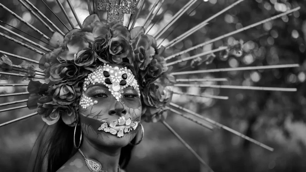 a woman in a costume with flowers on her head mexico
