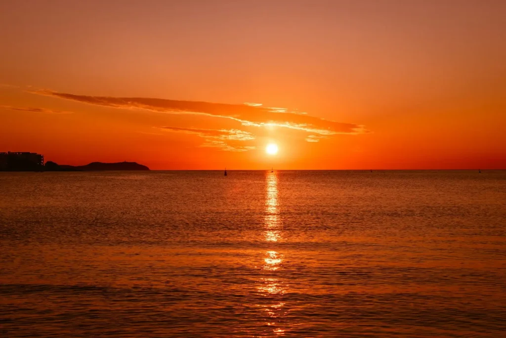 Sunset illuminating the sky with an orange glow in Spain.